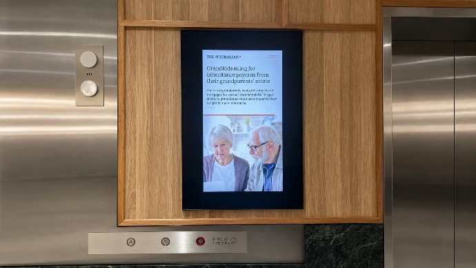 Digital menu boards installed above a quick-service restaurant counter by Innovateq