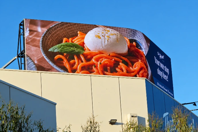 Large-format outdoor LED billboard installed on the That's Amore Cheese building in Thomastown, Victoria