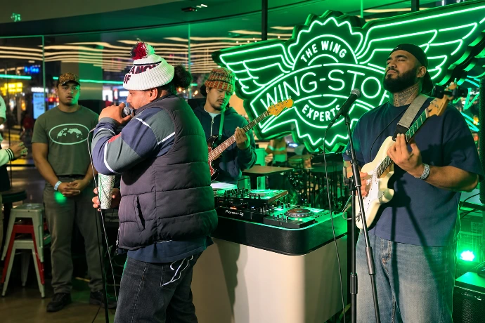 Digital menu boards and in-store technology installed at a Wingstop store