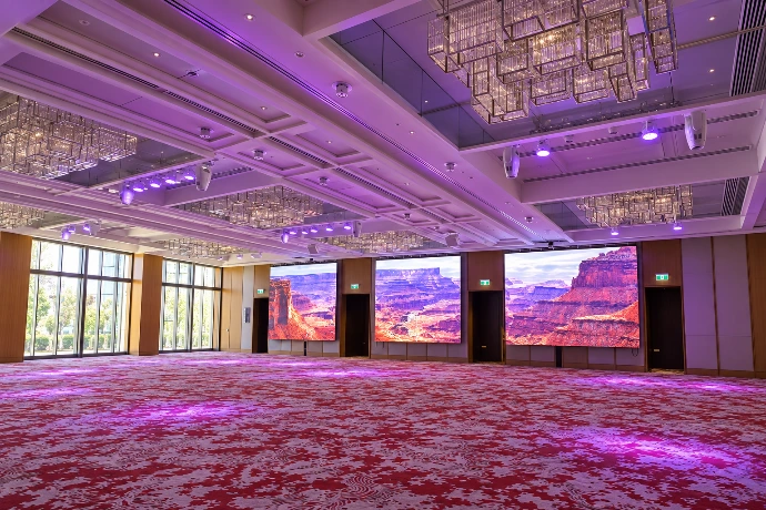 Guest-facing digital display installed in a hospitality venue